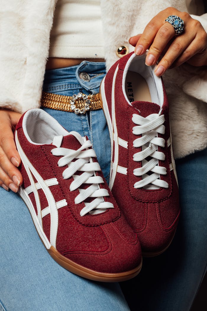 gallery-03 Bold red women's sneakers paired with a stylish outfit, enhancing modern casual fashion.